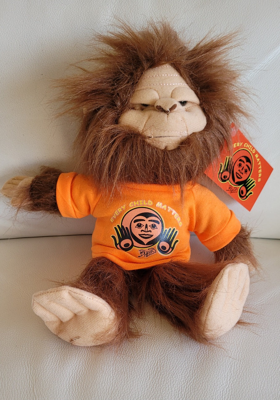 Skookum Sasquatch stuffie with Every Child Matters, Bill Helin design