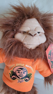 Skookum Sasquatch stuffie with Every Child Matters, Bill Helin design