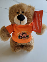 Load image into Gallery viewer, 10&quot; Teddy Bear stuffie with Every Child Matters Tshirt, a Native artist Bill Helin design
