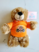 Load image into Gallery viewer, 10&quot; Teddy Bear stuffie with Every Child Matters Tshirt, a Native artist Bill Helin design
