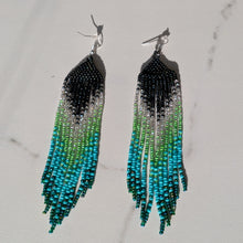 Laden Sie das Bild in den Galerie-Viewer, Long beaded fringe earrings with a black, white, green, and turquoise gradient design
