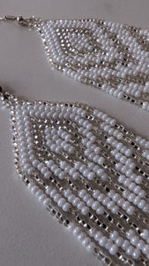close up of white chevron beaded earrings