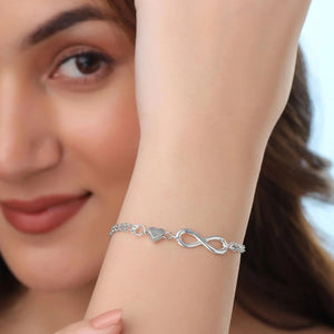 Silver coloured infinity bracelet with heart
