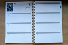 Laden Sie das Bild in den Galerie-Viewer, &quot;MIdnight Whispers&quot; 2026 Weekly Planner artwork by Karen Erickson - North of Fifty Indigenous Boutique
